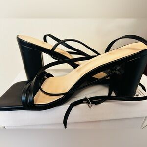 All black heels. Wraps around ankle. Size 10. Been wore once.